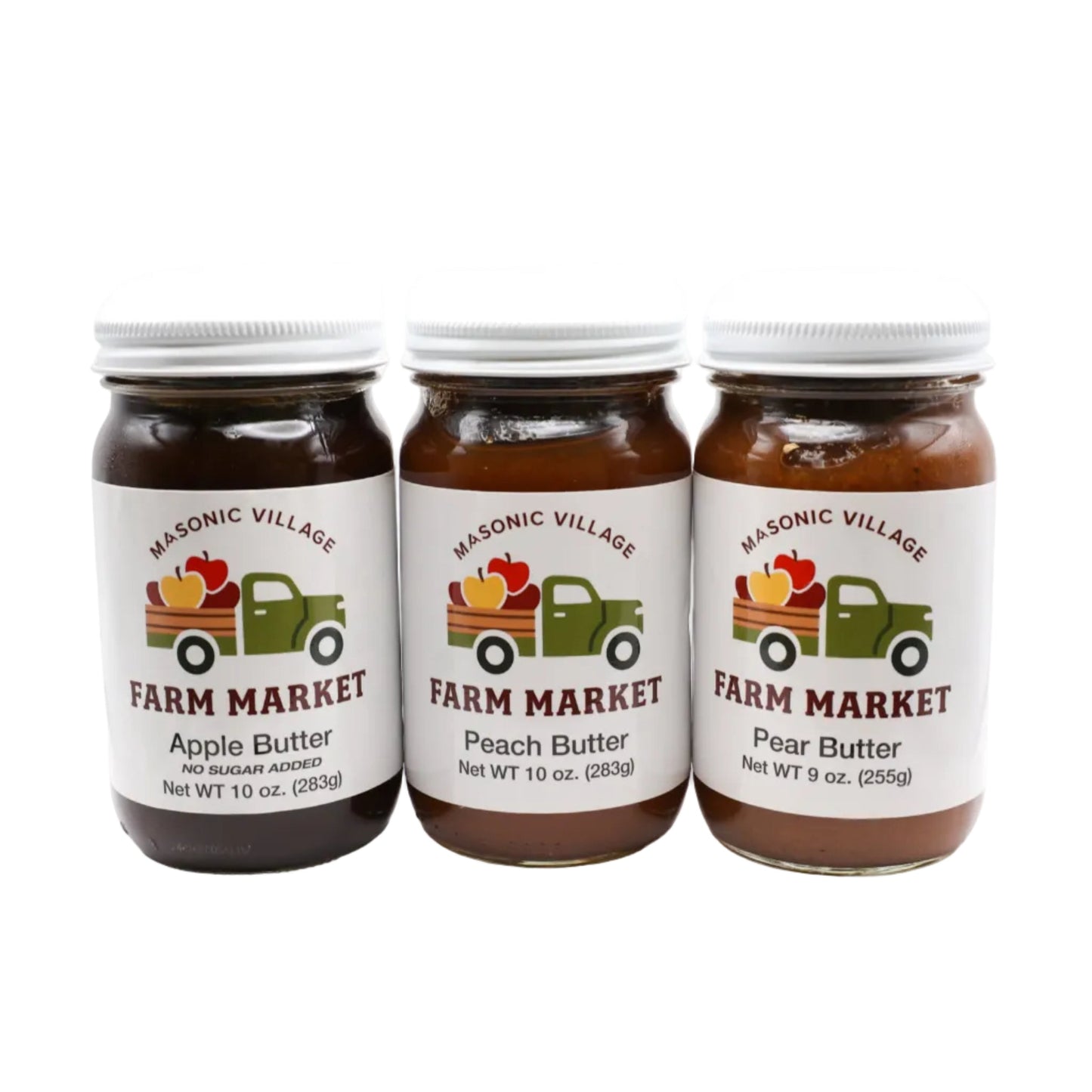 Three jars of Masonic Village Farm Market apple, peach, and pear butter on a white background.