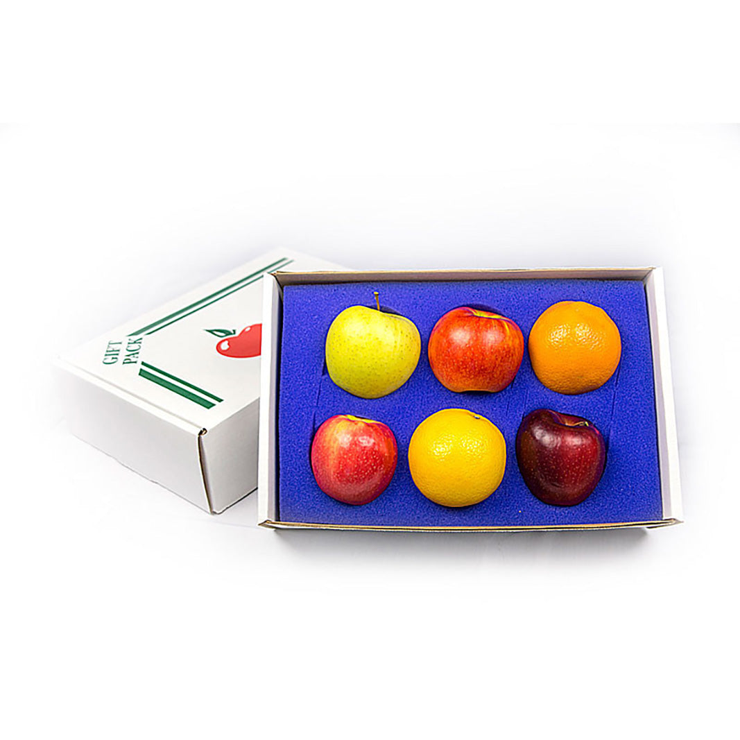Small box with apples and oranges on a white background. 