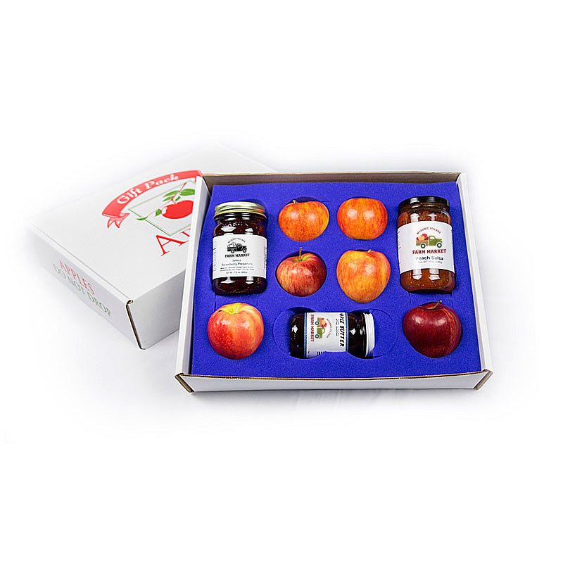Box of apples and jars with a visible brand logo on a white background