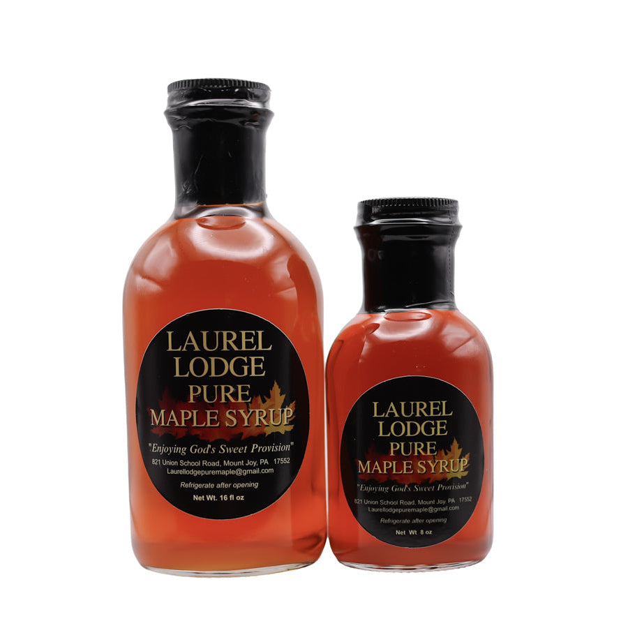 Two bottles of Laurel Lodge Pure Maple Syrup on a white background